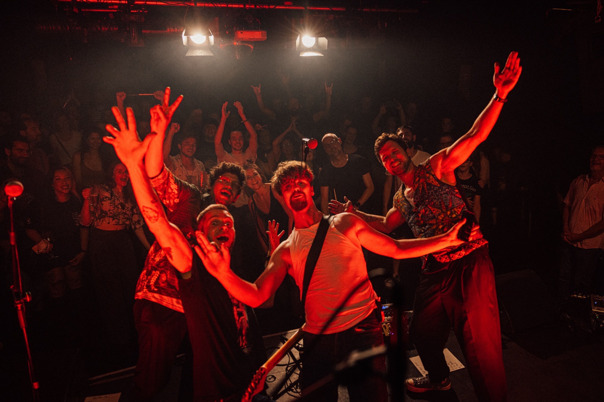 Two Fox Out — band on stage, arms out